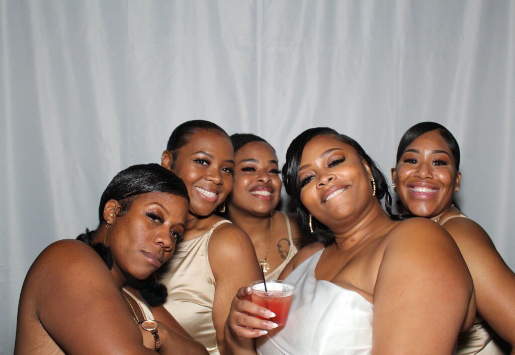 Bride and her best friends having fun in photo booth in Columbus Georgia