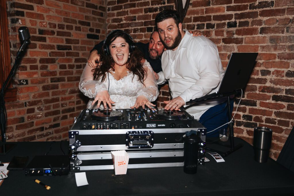 Wedding couple posing with DJ in Macon Georgia