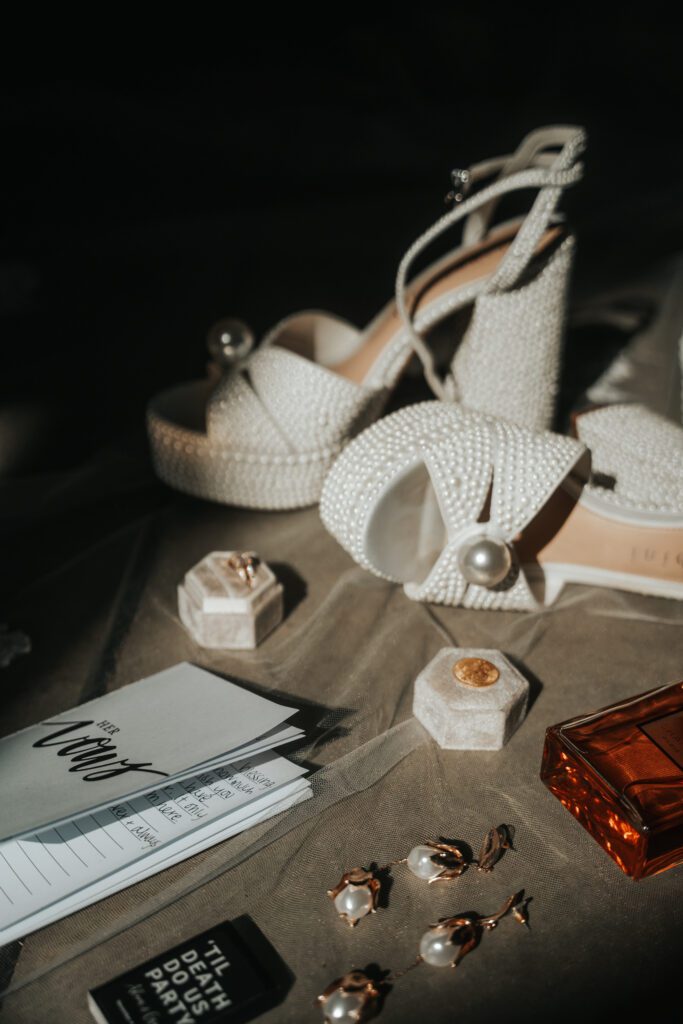 Brides wedding day shoes and other details in flay lay image