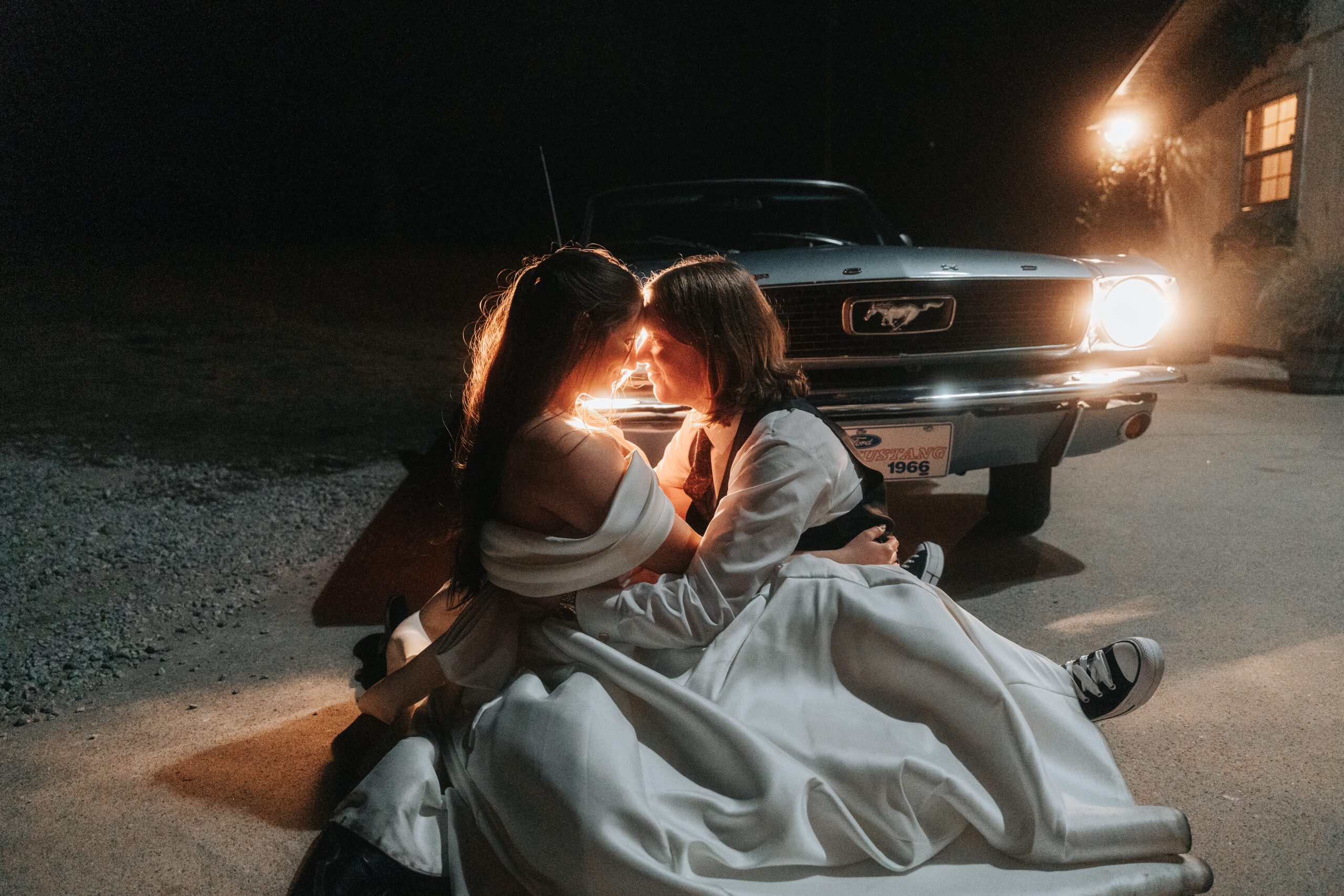 Bride and Groom Pose in Front of Car at night in Seale Alabama